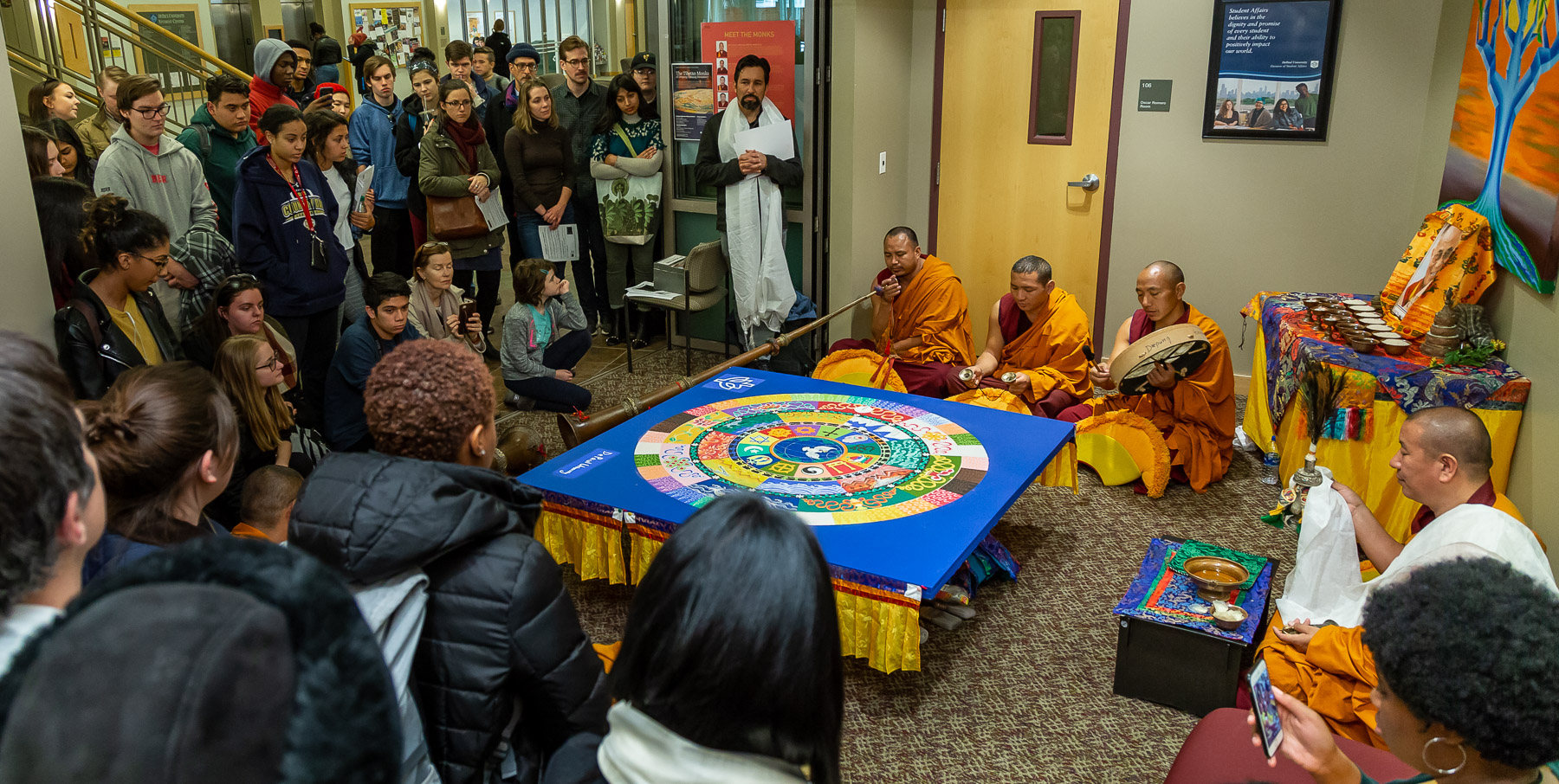 The monks perform a closing ceremony where, after a series of chants, they destroyed the mandala. (DePaul University/Jeff Carrion)